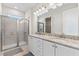 Bathroom boasts double sinks, granite counters, and a shower at 7783 Westland Dr, Kissimmee, FL 34747