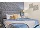Bedroom with king bed, accent wall, and soft color scheme at 7783 Westland Dr, Kissimmee, FL 34747