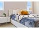 Bright bedroom with a cozy bed and modern nightstand at 7783 Westland Dr, Kissimmee, FL 34747