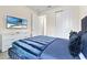 Bedroom with TV and dresser, offering additional sleeping space at 7783 Westland Dr, Kissimmee, FL 34747