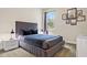 Cozy bedroom with a comfortable bed, nightstands, and plenty of natural light at 7783 Westland Dr, Kissimmee, FL 34747