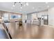 Spacious dining area with a large wood table and modern chandelier at 7783 Westland Dr, Kissimmee, FL 34747