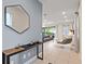Bright and airy entryway with modern console table and view into the living area at 7783 Westland Dr, Kissimmee, FL 34747
