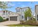 Two-story house with gray siding and brown garage at 7783 Westland Dr, Kissimmee, FL 34747