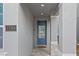Modern front door entry with stone accents and a welcoming mat at 7783 Westland Dr, Kissimmee, FL 34747