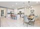 Open kitchen with white cabinets, granite countertops, and an island at 7783 Westland Dr, Kissimmee, FL 34747