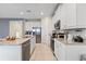 Well-equipped kitchen with granite counters and stainless steel appliances at 7783 Westland Dr, Kissimmee, FL 34747