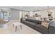 Open living room featuring comfortable seating and an open concept kitchen at 7783 Westland Dr, Kissimmee, FL 34747