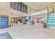 Modern building lobby with Amazon pickup, coffee house, and stairs at 7783 Westland Dr, Kissimmee, FL 34747
