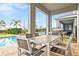 Outdoor patio with dining set and grill at 7783 Westland Dr, Kissimmee, FL 34747