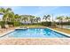 Inviting community pool with a spa and lounge chairs at 7783 Westland Dr, Kissimmee, FL 34747