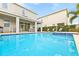 Inviting blue swimming pool with a spa at 7783 Westland Dr, Kissimmee, FL 34747