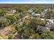 Aerial view of a neighborhood with lush trees and houses at 810 E Central Blvd, Orlando, FL 32801