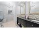 Stylish bathroom featuring granite countertops, double vanity, and elegant lighting at 810 E Central Blvd, Orlando, FL 32801