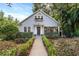 Charming light blue house with white picket fence and landscaped yard at 810 E Central Blvd, Orlando, FL 32801