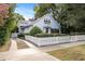 Gray house with white picket fence and a spacious driveway at 810 E Central Blvd, Orlando, FL 32801