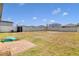 Fenced backyard with patio and storage shed at 841 Teton St, Haines City, FL 33844