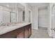 Bathroom with double sinks, granite countertop, and walk-in shower at 841 Teton St, Haines City, FL 33844
