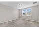 Bright bedroom with two windows and neutral carpeting at 841 Teton St, Haines City, FL 33844
