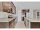 Modern kitchen with dark wood cabinets and granite countertops at 841 Teton St, Haines City, FL 33844