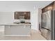 Kitchen island with granite countertop and stainless steel appliances at 841 Teton St, Haines City, FL 33844