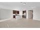 Open kitchen with stainless steel appliances and granite countertops at 841 Teton St, Haines City, FL 33844
