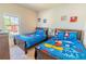 Mickey Mouse themed bedroom with two twin beds at 8923 Shine Dr, Kissimmee, FL 34747