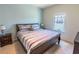 Spacious bedroom with large window and comfortable bed at 8923 Shine Dr, Kissimmee, FL 34747