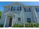 Front view of light blue townhome at 8923 Shine Dr, Kissimmee, FL 34747