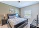 Main bedroom with king-size bed and ensuite bathroom at 8923 Shine Dr, Kissimmee, FL 34747
