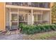 Ground-level view of the home's screened patio and surrounding landscape at 90 Moree Loop # 15, Winter Springs, FL 32708