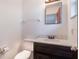 Bathroom with vanity, toilet and mirror at 1006 Center St, Ocoee, FL 34761