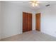 Simple bedroom with neutral walls, carpet, and ceiling fan at 1006 Center St, Ocoee, FL 34761