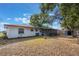 Back exterior view of house with shed and screened porch at 1006 Center St, Ocoee, FL 34761