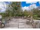 Spacious back deck with several chairs and a wooden railing at 1101 James Ave, Deltona, FL 32738