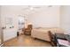 Bright bedroom featuring neutral colors, ceiling fan, dresser, seating and desk at 1101 James Ave, Deltona, FL 32738