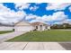 One-story house with a white garage door and a well-maintained lawn at 1101 James Ave, Deltona, FL 32738