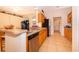 Functional kitchen space featuring a dishwasher, sink, and wood cabinetry at 1101 James Ave, Deltona, FL 32738