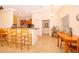 Kitchen and dining area featuring a breakfast bar, a table with seating, and wooden cabinets at 1101 James Ave, Deltona, FL 32738