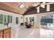 Breakfast nook with wood-beamed ceiling and view of pool at 1107 Pheasant Cir, Winter Springs, FL 32708