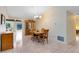 Formal dining room with wood floors and large windows at 1107 Pheasant Cir, Winter Springs, FL 32708