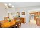 Elegant dining room with hardwood floors and a view into the kitchen at 1107 Pheasant Cir, Winter Springs, FL 32708