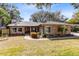 Brick house with landscaped lawn and walkway at 1107 Pheasant Cir, Winter Springs, FL 32708