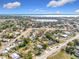 Aerial perspective of houses and streets near a lake at 1119 Pine Ave, Tavares, FL 32778