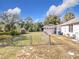 Large backyard with chain link fence and detached garage at 1119 Pine Ave, Tavares, FL 32778