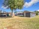 Large backyard with shed and golf cart at 1119 Pine Ave, Tavares, FL 32778