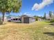 Spacious backyard with shed and storage at 1119 Pine Ave, Tavares, FL 32778