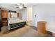 Main bedroom with wood dresser and carpet flooring at 1119 Pine Ave, Tavares, FL 32778