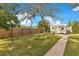 Landscaped backyard with a shed and walkway at 1203 Waverly Way, Longwood, FL 32750