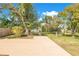 Large backyard with mature trees and a shed at 1203 Waverly Way, Longwood, FL 32750